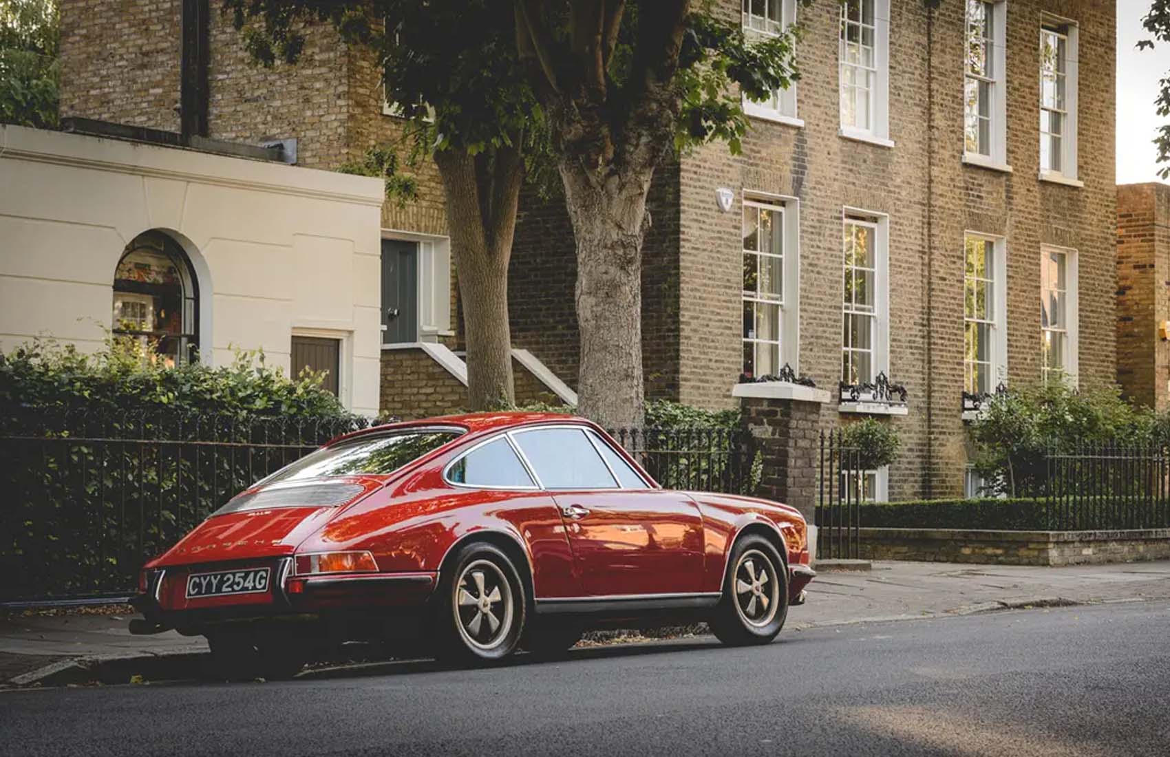 classic car Red Porsche 911 parked on a street