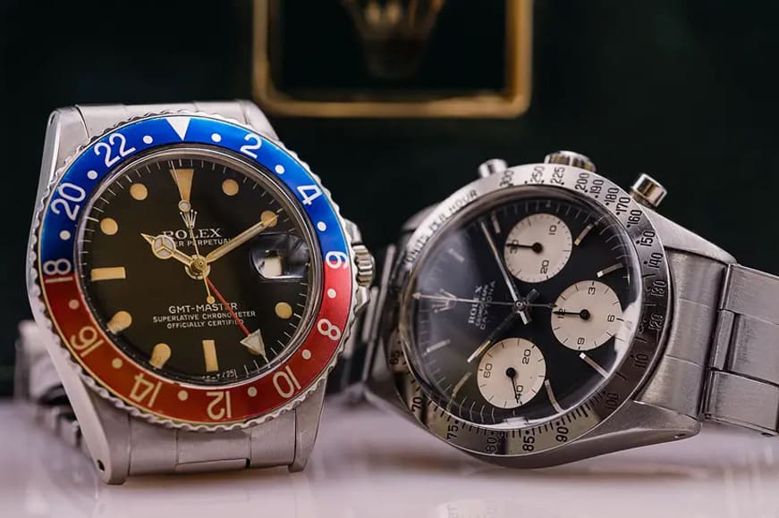 Investing in luxury watches, 2 rolex watches on a wooden table