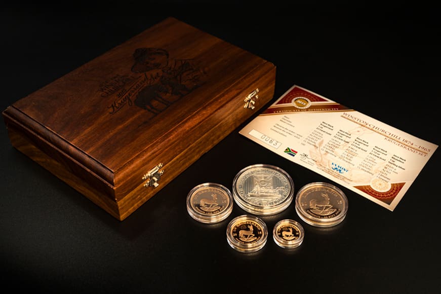 Limited edition gold coins next to case with certificate