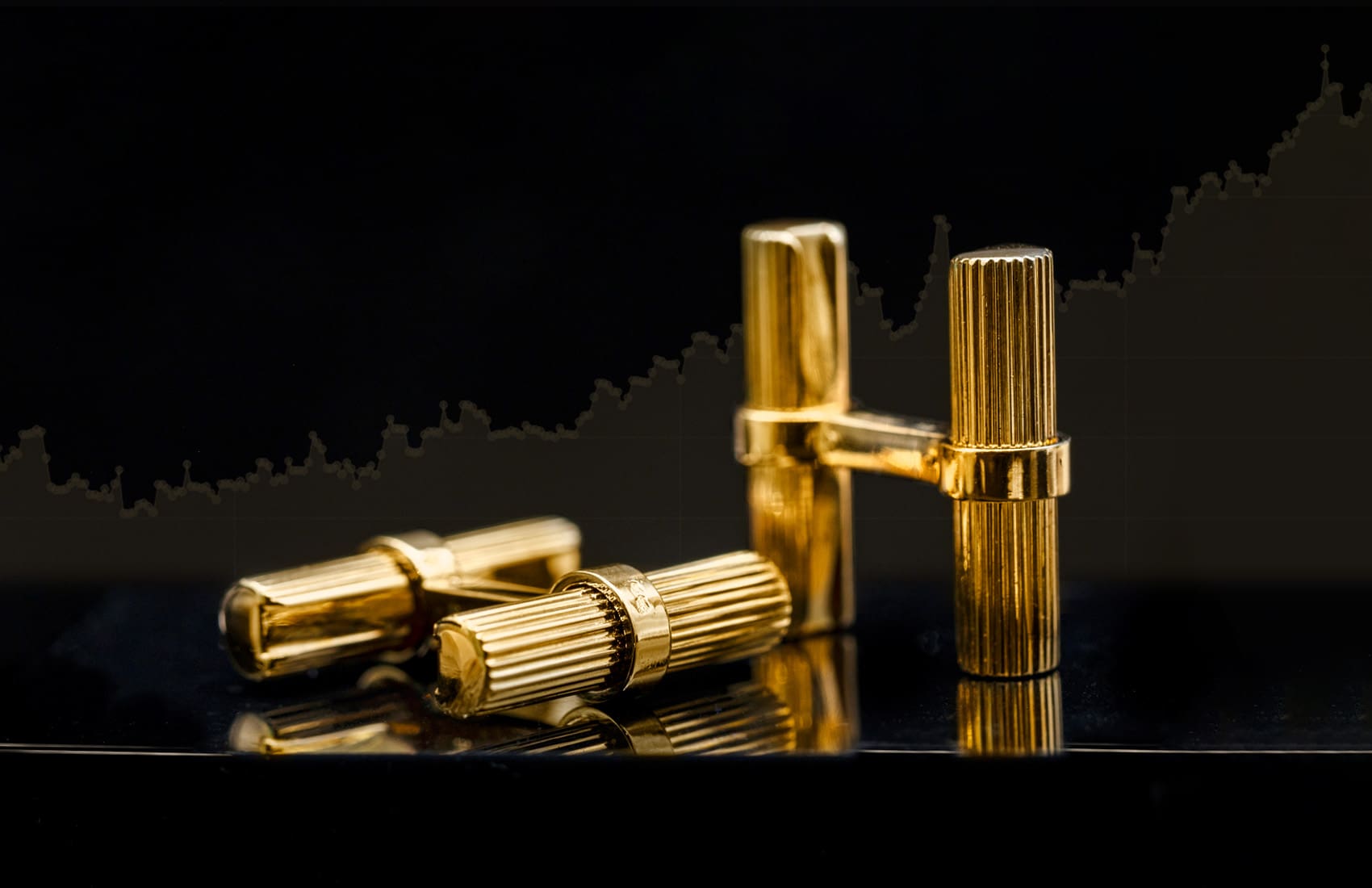 18K yellow gold cufflinks with gold value chart background
