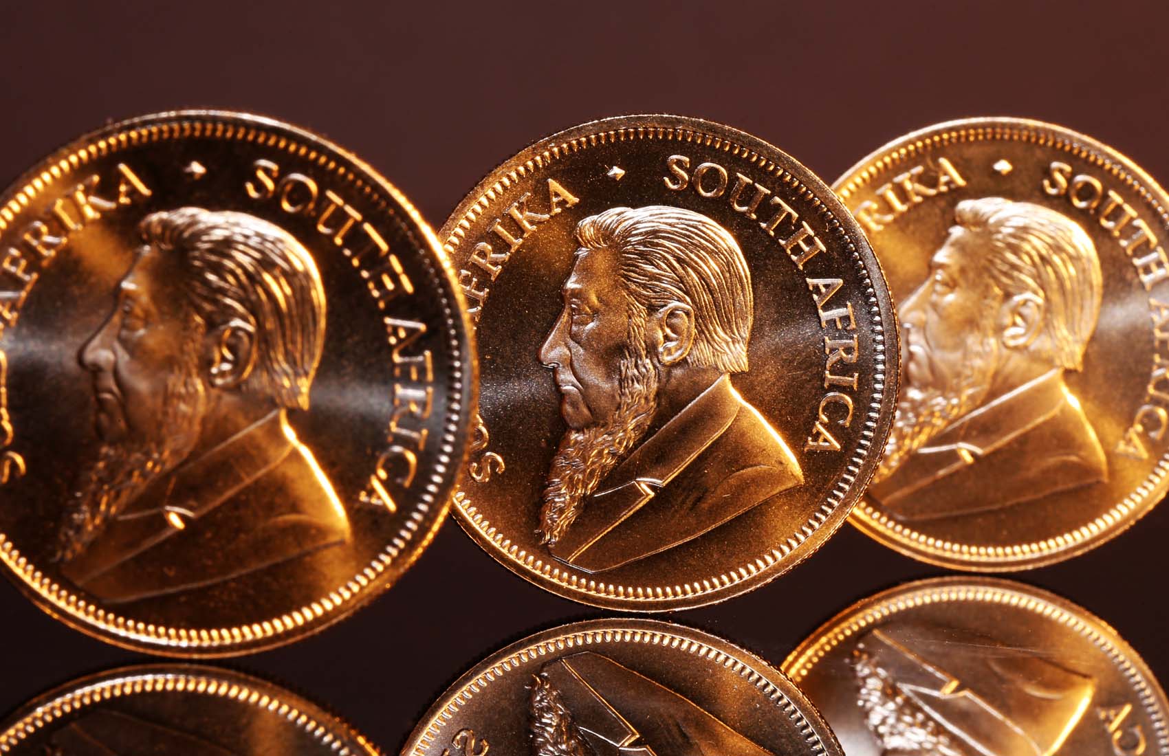 Three gold Krugerrands
